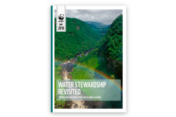 Cover shot of a water stewardship report. A river between mountains and a rainbow across the title